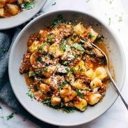 Short Rib Ragu in bowls with fork.
