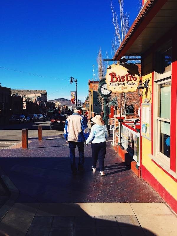 Man and woman holding hands.