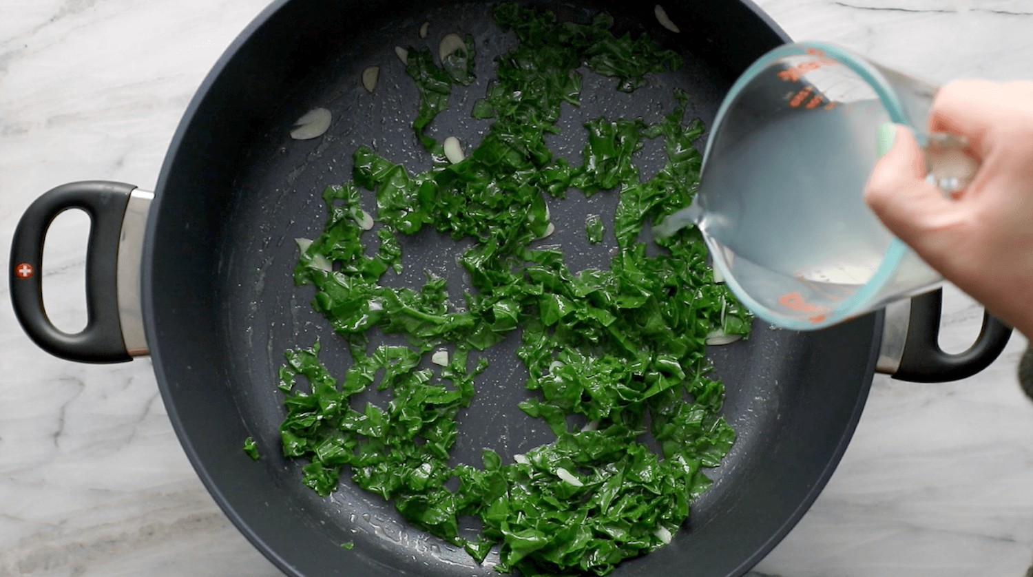 Sautéed kale in a skillet.