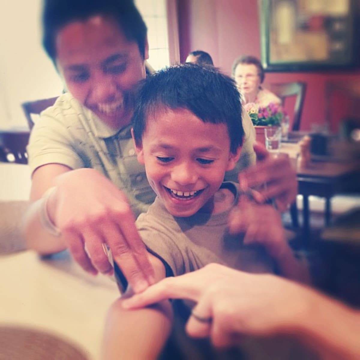 Boys touching their arms.